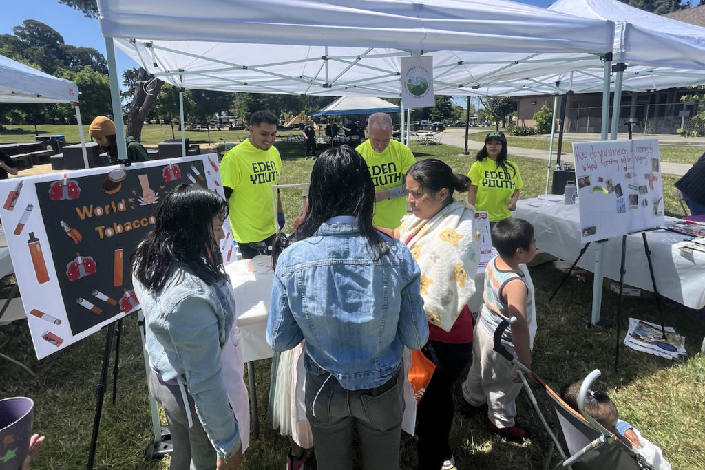 After opening speeches, community members can explore booths at the resource fair. Photo courtesy of Eden Youth 